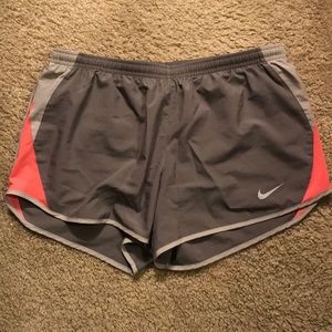 Gray and pink Nike running shorts